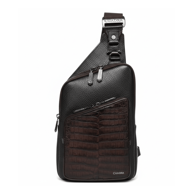 Bolso tipo crossbody negro con panel frontal en piel de caimán.