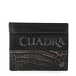 Cartera oxford con franja inferior en piel exotica y panel superior texturizado.