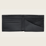 Interior de la cartera con varios compartimentos y grabado Cuadra.