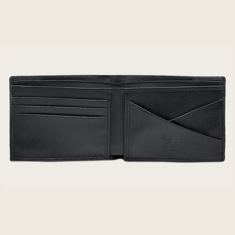 Interior de la cartera con varios compartimentos y grabado Cuadra.