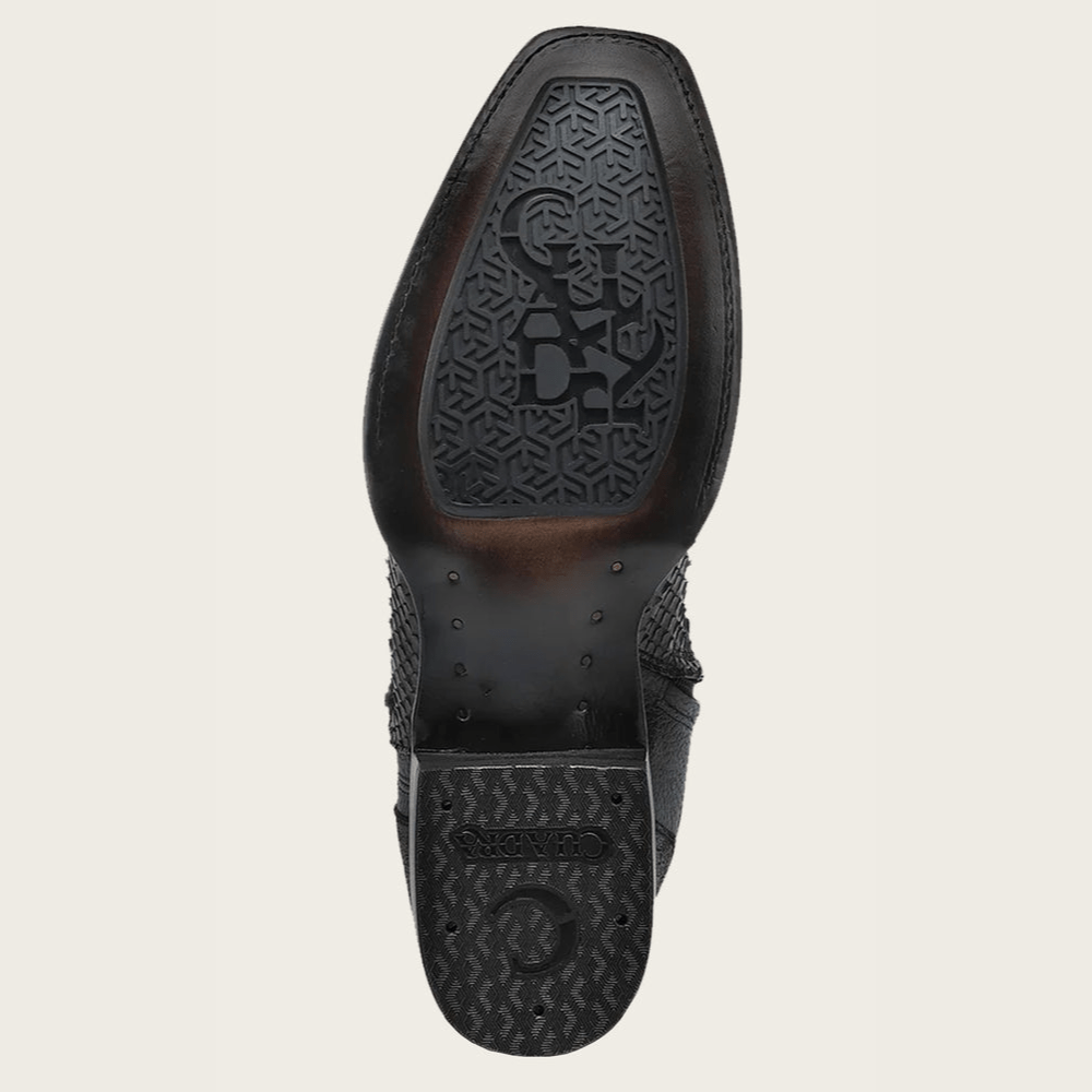 Suela de la bota con diseño en relieve y logotipo Cuadra.